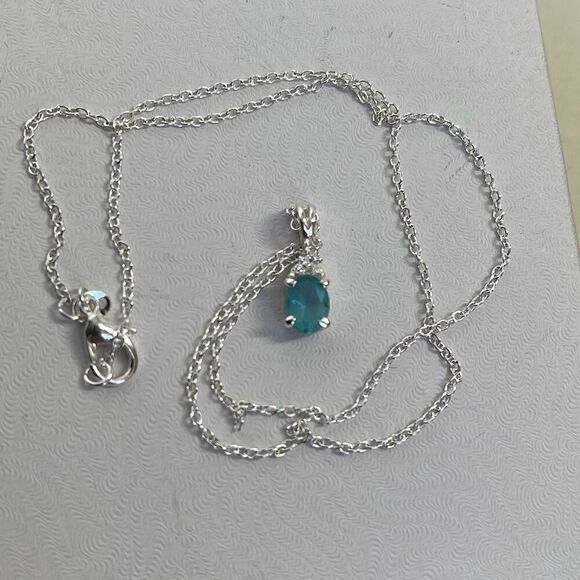 Boutique Jewelry - Sterling silver with light blue quartz. Sterling silver setting and chain.